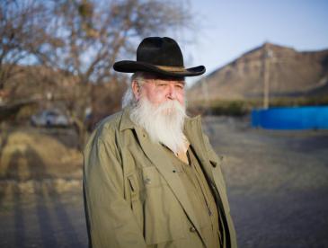 Randall Cater standing in front of mountains in Texas.