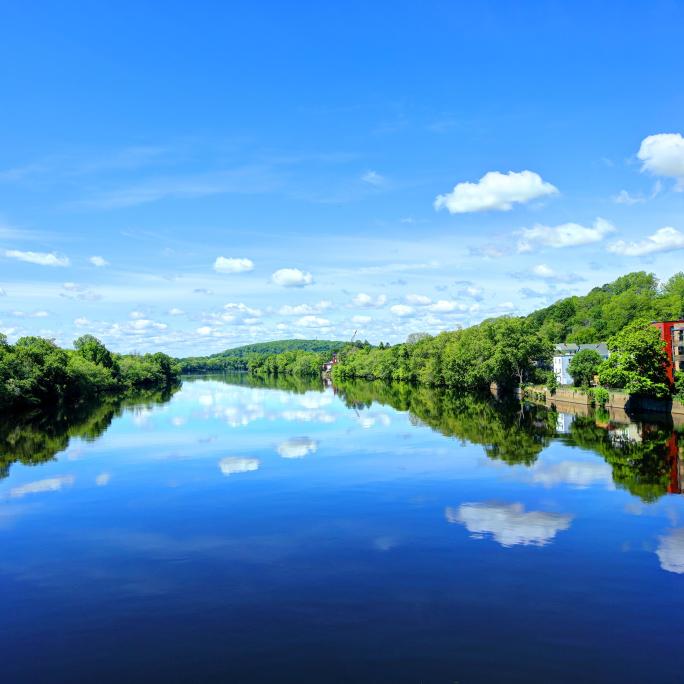 Blue sky over a reflective river