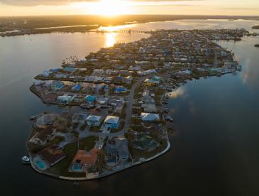 Island communities vulnerable to extreme storms on the west coast of Florida, viewed from overhead.