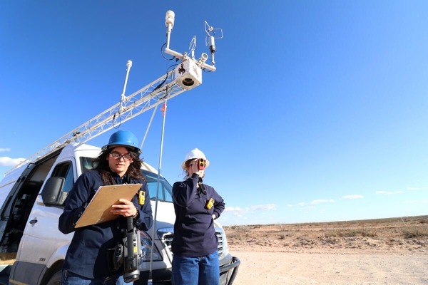 Workers gathering data on methane pollution