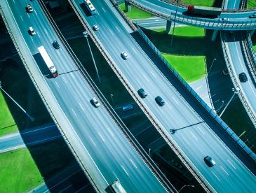 Cars and trucks traveling on looping highways